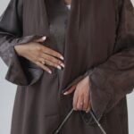 Luxurious mocha jacquard abaya with delicate floral detailing, elegant beaded sleeves and neckline, finished with a soft matching chiffon scarf