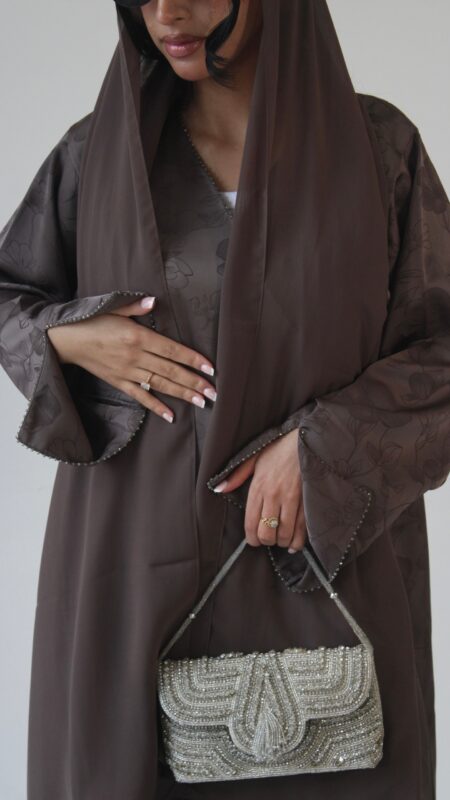 Luxurious mocha jacquard abaya with delicate floral detailing, elegant beaded sleeves and neckline, finished with a soft matching chiffon scarf