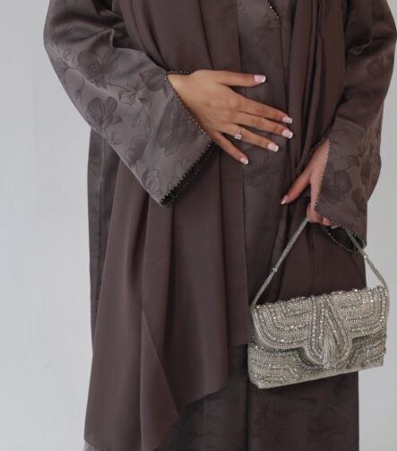 Serene abaya Fabric - Jacquard Luxurious mocha jacquard abaya with delicate floral detailing, elegant beaded sleeves and neckline, finished with a soft matching chiffon scarf