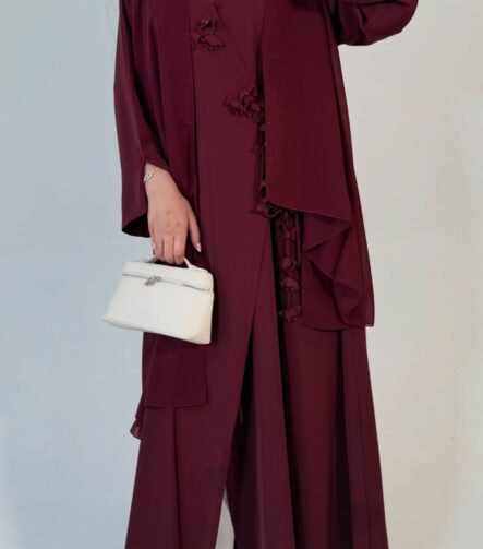 Floral wrap abaya - berry Elegant deep teal abaya featuring delicate 3D floral detailing with pearl-beaded flower centres, inner and outer tie closures Comes with a premium chiffon scarf Fabric - Korean nida Colours - Teal Pardah Uk Abaya