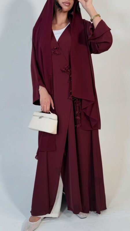 Floral wrap abaya - berry Elegant deep teal abaya featuring delicate 3D floral detailing with pearl-beaded flower centres, inner and outer tie closures Comes with a premium chiffon scarf Fabric - Korean nida Colours - Teal Pardah Uk Abaya