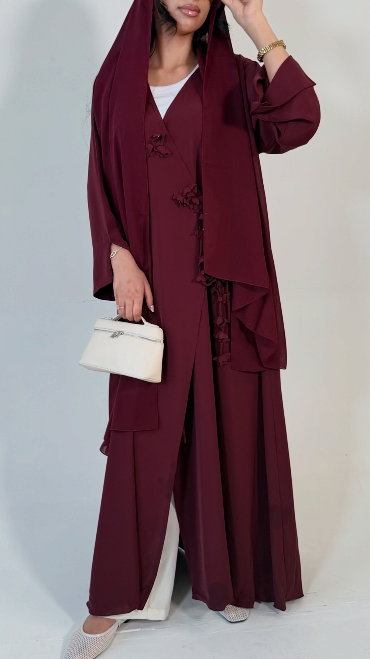 Berry 1 Floral wrap abaya - berry Elegant deep teal abaya featuring delicate 3D floral detailing with pearl-beaded flower centres, inner and outer tie closures Comes with a premium chiffon scarf Fabric - Korean nida Colours - Teal Pardah Uk Abaya