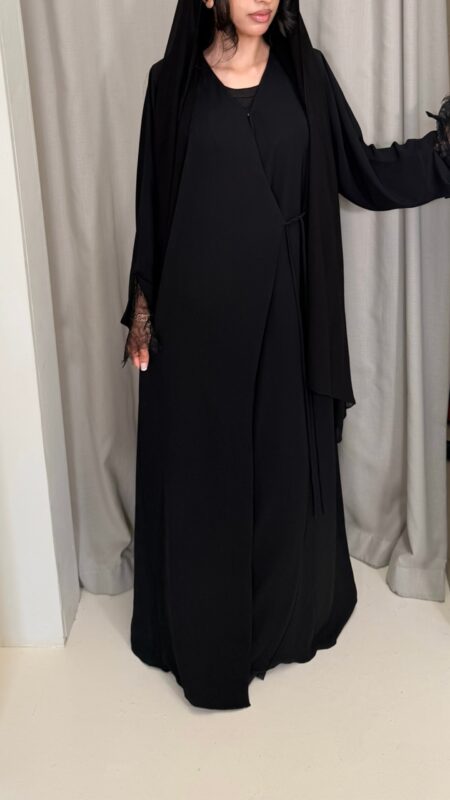 Wrap abaya - Black Fabric - Korean nida 2 Piece - abaya & scarf Soft, flowing fabric, featuring delicate lace sleeves, an inner tie for a secure fit, and an outer tie for an adjustable, flattering silhouette. Perfect for a timeless and modest look. By pardah