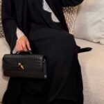 Wrap abaya - Black with white lace Fabric - Korean nida 2 Piece - abaya & scarf Soft, flowing fabric, featuring delicate lace sleeves, an inner tie for a secure fit, and an outer tie for an adjustable, flattering silhouette. Perfect for a timeless and modest look. Pardah UK