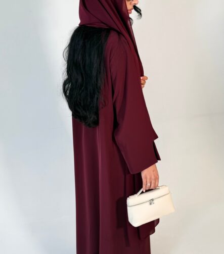 Floral wrap abaya - berry Elegant deep teal abaya featuring delicate 3D floral detailing with pearl-beaded flower centres, inner and outer tie closures Comes with a premium chiffon scarf Fabric - Korean nida Colours - Teal abaya by pardah