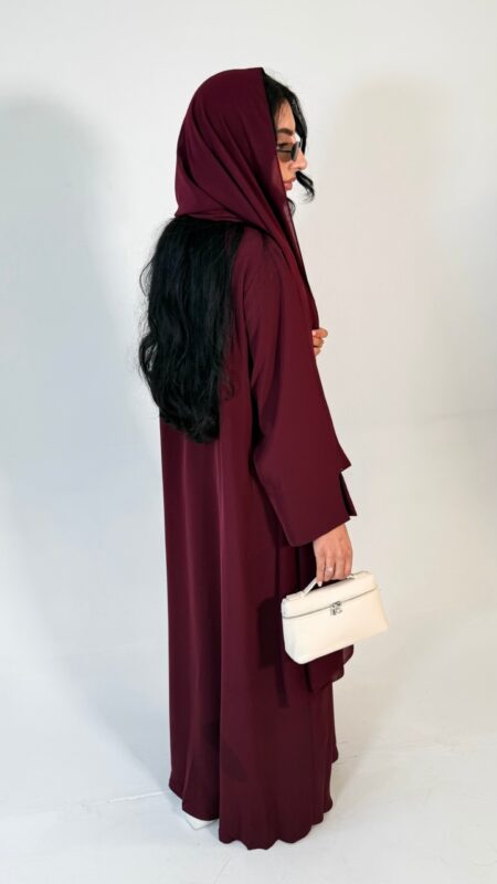 Floral wrap abaya - berry Elegant deep teal abaya featuring delicate 3D floral detailing with pearl-beaded flower centres, inner and outer tie closures Comes with a premium chiffon scarf Fabric - Korean nida Colours - Teal abaya by pardah