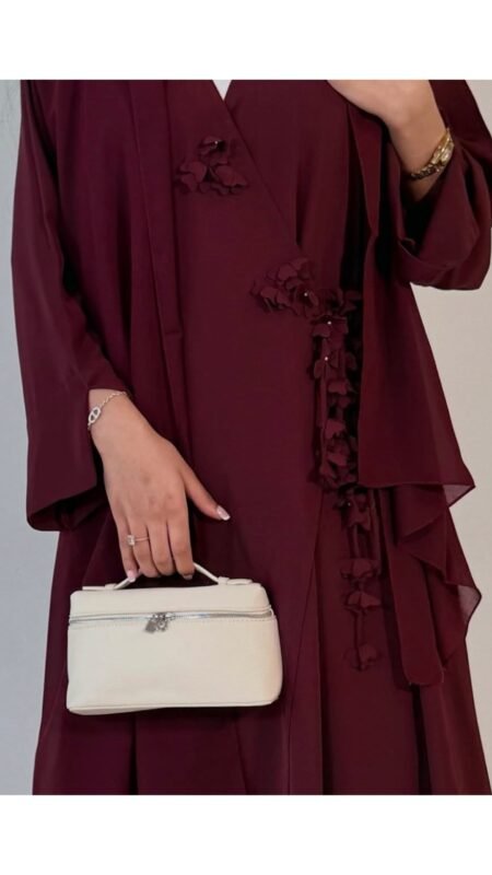 Floral wrap abaya - berry Elegant deep teal abaya featuring delicate 3D floral detailing with pearl-beaded flower centres, inner and outer tie closures Comes with a premium chiffon scarf Fabric - Korean nida Colours - Teal