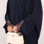 Sophisticated navy wrap abaya with a flattering draped fit. Crafted from luxurious, lightweight fabric for all-day comfort and effortless modesty.