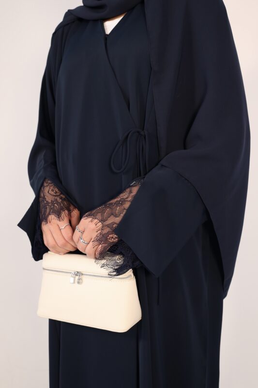 Sophisticated navy wrap abaya with a flattering draped fit. Crafted from luxurious, lightweight fabric for all-day comfort and effortless modesty.