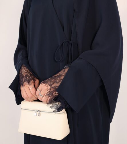 Sophisticated navy wrap abaya with a flattering draped fit. Crafted from luxurious, lightweight fabric for all-day comfort and effortless modesty.