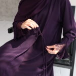 Stunning plum wrap abaya with a graceful draped fit. Crafted from premium, breathable fabric for all-day elegance and effortless style.