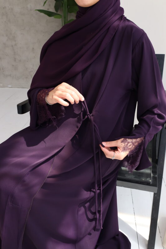 Stunning plum wrap abaya with a graceful draped fit. Crafted from premium, breathable fabric for all-day elegance and effortless style.