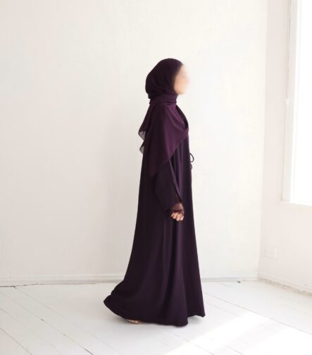 Rich plum meets effortless draping in this luxurious wrap abaya. The vibrant jewel-tone color flatters every skin tone, while the flowing design ensures comfort and refined modesty from sunrise to sunset.