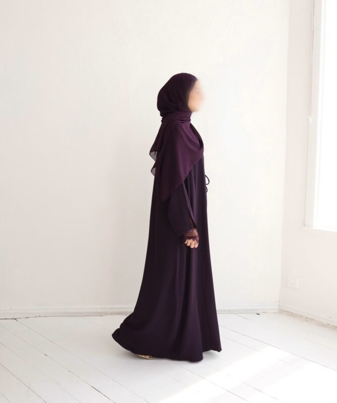 Rich plum meets effortless draping in this luxurious wrap abaya. The vibrant jewel-tone color flatters every skin tone, while the flowing design ensures comfort and refined modesty from sunrise to sunset.